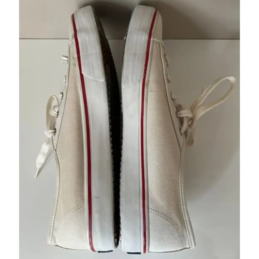 Keds low top canvas lace up sneakers with red trim. Size 8.